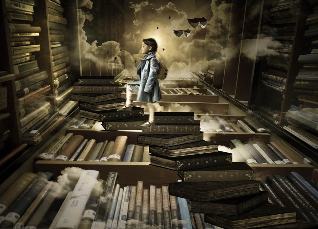 little girl on a staircase of books